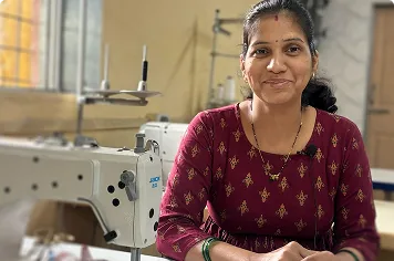 A woman beside a sewing machine