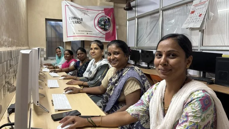 Women learning at computers